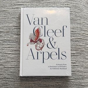 Van Cleef & Arpels White Cover with Navy Text and Red Accent
